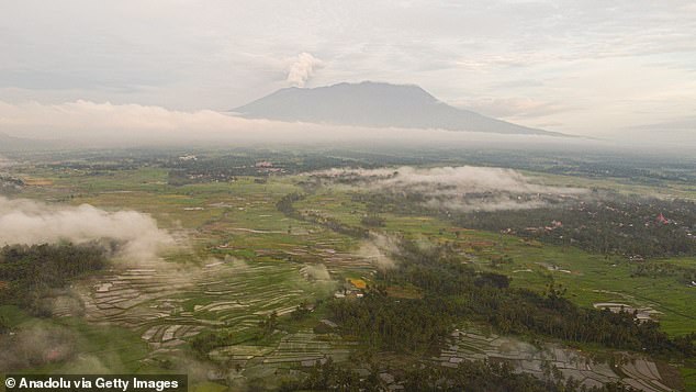 Mount Marapi spews columns of volcanic ash during an eruption, seen from Tanah Datar District, West Sumatra, Indonesia on January 13, 2024