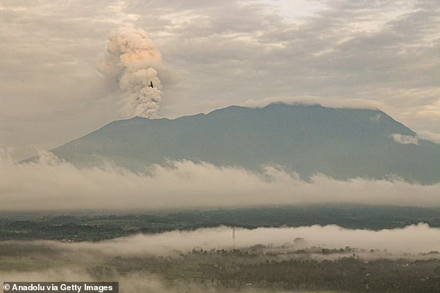 Mount Marapi spews columns of volcanic ash during an eruption, seen from Tanah Datar District, West Sumatra, Indonesia on January 13, 2024