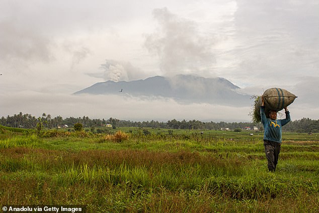 Mount Marapi spews columns of volcanic ash during an eruption, seen from Tanah Datar District, West Sumatra, Indonesia on January 13, 2024