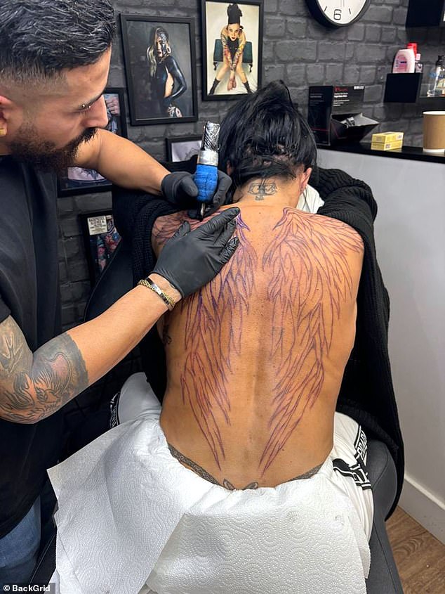 The former glamor model was clearly feeling angelic when she arrived at the studio, as The Sun revealed on Friday that she had wings tattooed on her back.