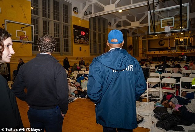 Adams looked at the gymnasium where the migrants slept on the floor.  At 4:30 am they were returned to the shelter