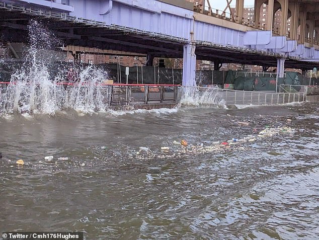 Photos and videos shared by social media users show waves lapping over walkways and buildings along the Hudson and East rivers in Manhattan and Brooklyn