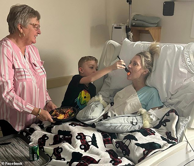 Mullins shared a touching photo of her youngest son helping to feed her