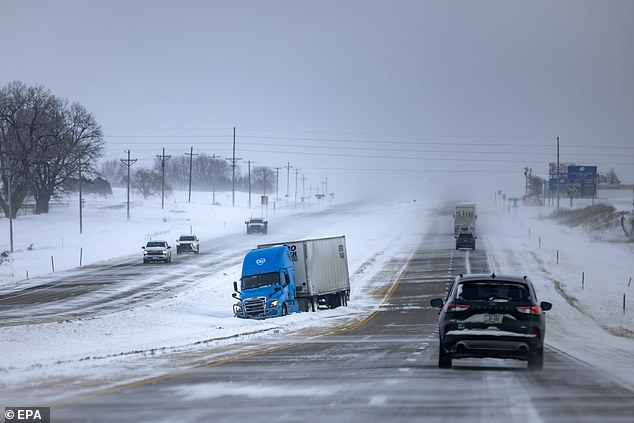 Haley showed up in Iowa City, where the temperature was 6F, but the wind chill made it feel like -15F.  A truck is seen in a median in Dubuque, Iowa, after skidding off the road