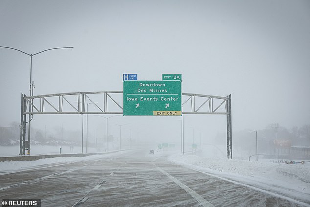 Snow covers a highway after a snowstorm left several inches of snow in Des Moines