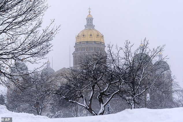 The Iowa State Capitol building was surrounded by snow on Friday as blizzards blanketed the state