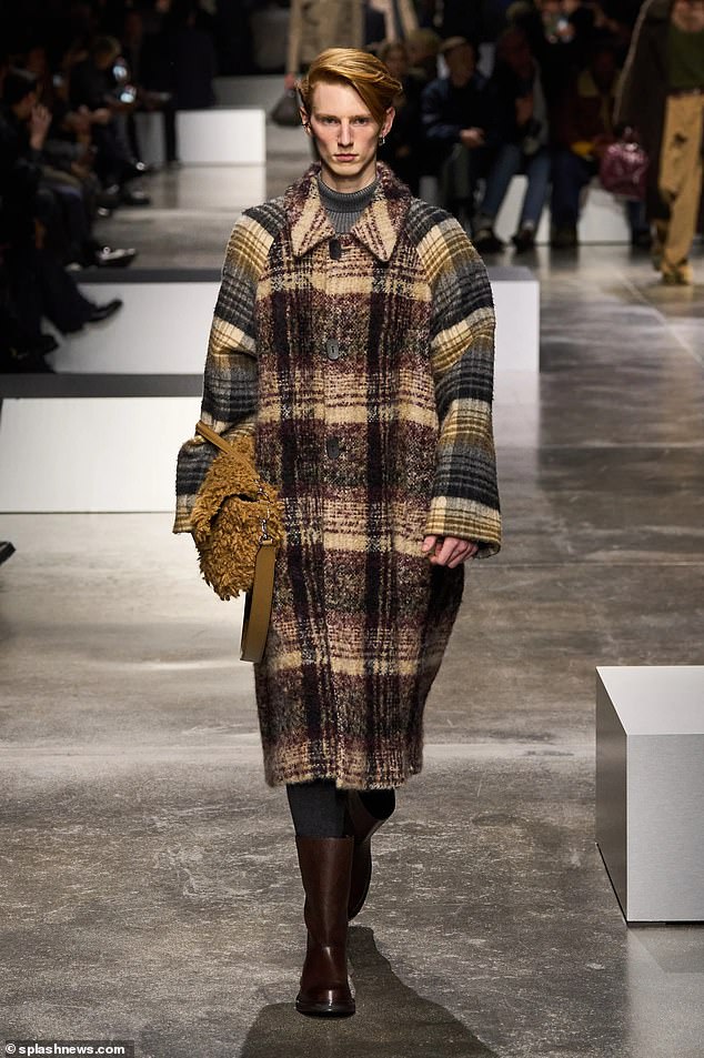 Fendi's new collection featured outfits that would be suitable for a damp winter's day on the moors at Balmoral, including generous overcoats, leather boots, oiled waxed jackets and loose sweaters in moss green and slate gray tones.