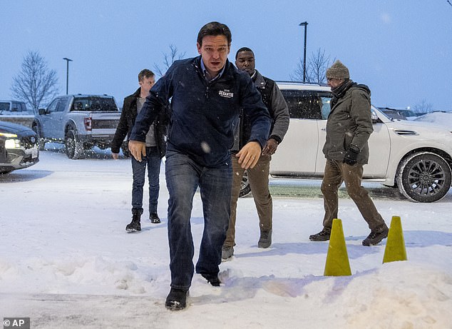 Are those snow boots or the other one?  Florida Governor Ron DeSantis is seen here tiptoeing through the snow in Iowa on Friday ahead of Monday's caucuses