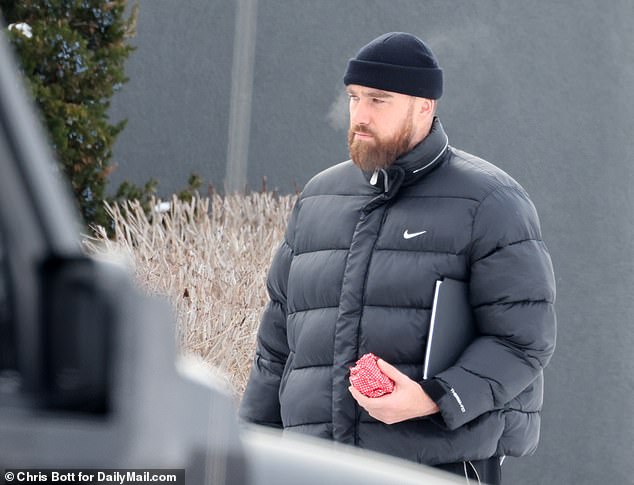 A grim-looking Travis Kelce was spotted leaving the Kansas City Chiefs team hotel on Saturday amid reports that he and his girlfriend Taylor Swift had their first burglary