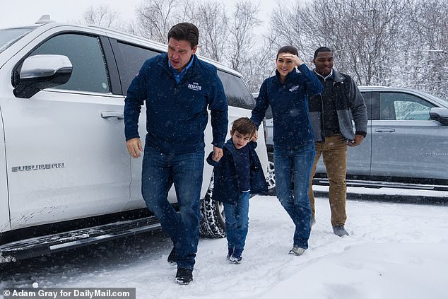 Florida Governor Ron DeSantis, his son Mason and his wife Casey walk into the Urbandale, Iowa headquarters of his 2024 presidential campaign on Friday. The weather has forced the candidates to cancel a number of campaign appearances ahead of the Iowa caucuses have canceled Monday