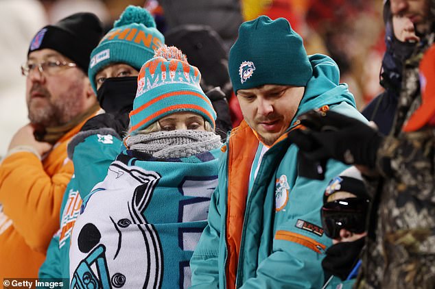 Miami Dolphins fans watch before the AFC Wild Card Playoffs in frigid Kansas City