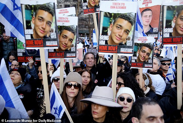 Edan Alexander, 20, (pictured in the front posters) from New Jersey moved to Israel with his family in 2022.  He was kidnapped on October 7 and has not been seen or heard from since.  Many of his loved ones gathered at Friday's demonstration calling for his immediate release