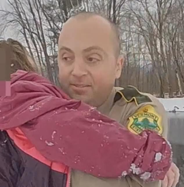 Video shows the brave officer holding the girl and swimming back to shore as state trooper Keith Cote helps pick up the girl and carries her to a waiting Cambridge Rescue ambulance