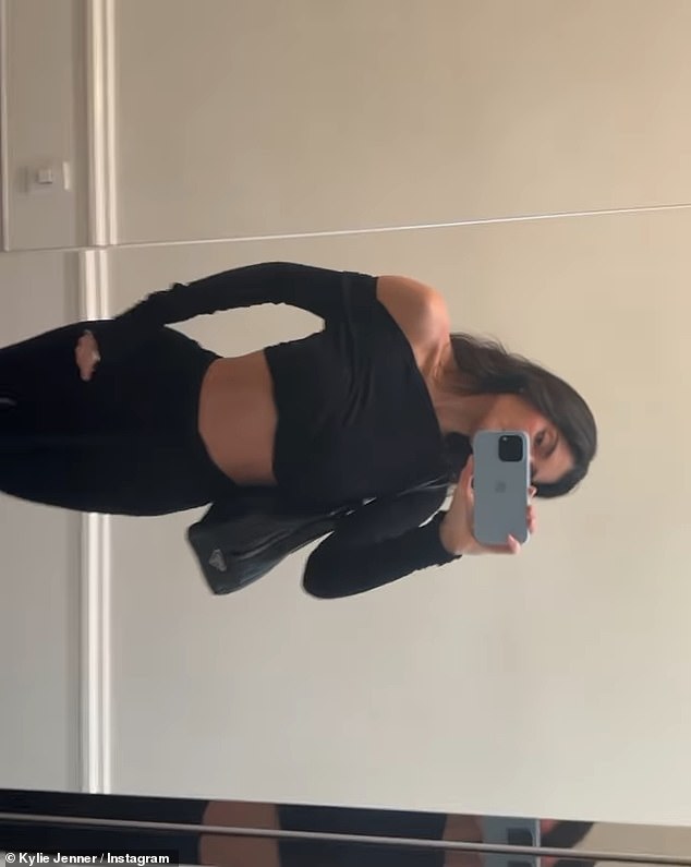 On the same day, she also shared a grid post showing off her sexy, skin-baring outfit of the day.  The Kylie Cosmetics founder wore an all-black ensemble with a long-sleeved crop top that she wore off one shoulder