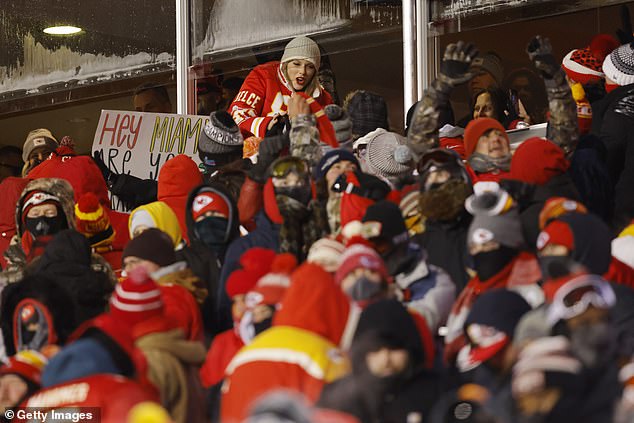 Swift leaned out of her suite to high five Chiefs fans as they celebrated scoring a touchdown