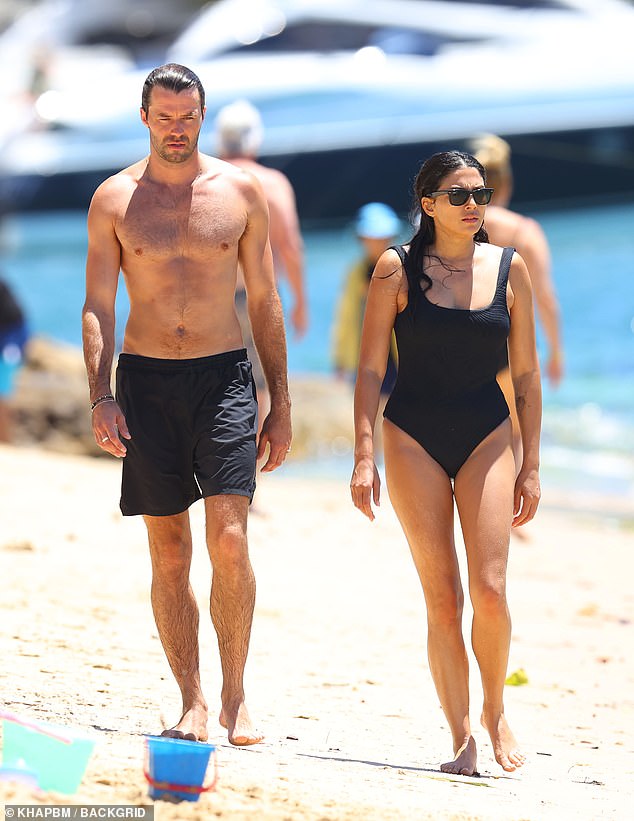 With her black hair drenched in saltwater and stylish sunglasses on her face, the stunner strutted her stuff next to Thomas on the beach.