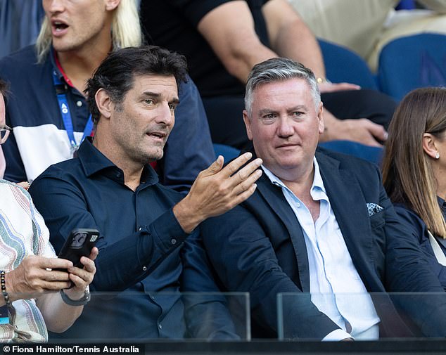 Mark Weber and Eddie McGuire seemed deeply involved in the match, exchanging notes as they watched