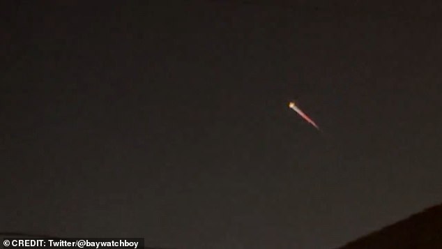 Another eyewitness posted a similar video on X, formally known as Twitter, of the rocket taking off high into the night sky with the caption: 'That was pretty cool'