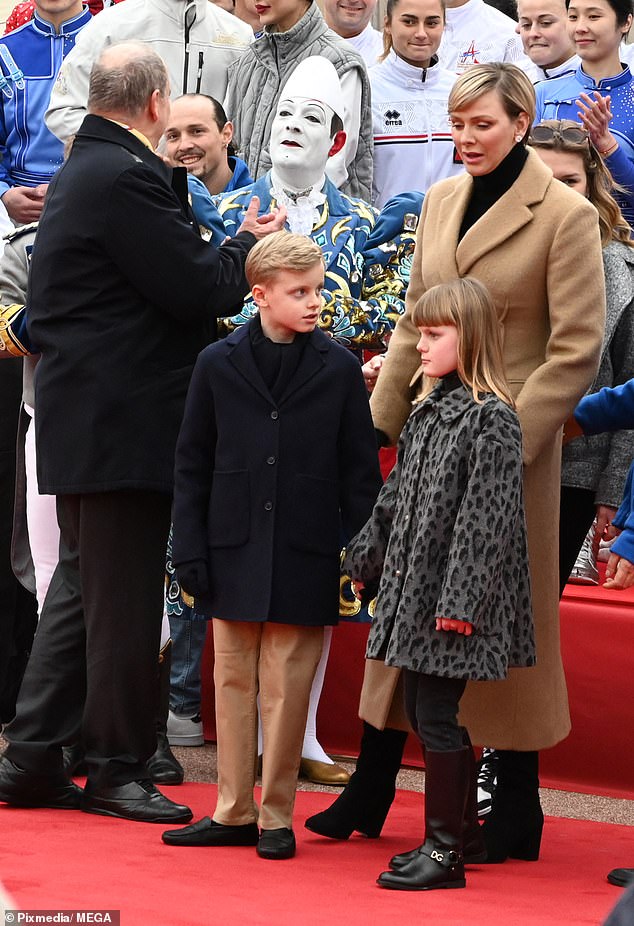 Princess Charlene looked quintessentially chic as she dressed warmly in a beige coat which she teamed with a black turtleneck