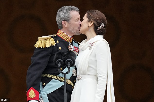 Princess Isabella, 16, went for a striking red ensemble, with her hair pulled back into a sleek bun.  She waved enthusiastically to the crowd and sang along to their rendition of the Danish national anthem