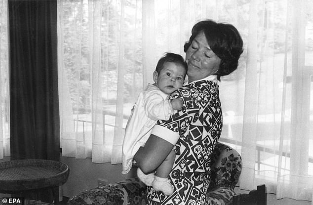 The future Crown Princess Mary of Denmark is pictured in the arms of her mother Henrietta Clark Donaldson in 1972 in Hobart, Tasmania