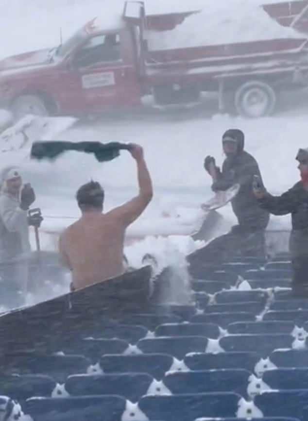 The fan seemed to be enjoying himself as he helped clear the field for $20 an hour