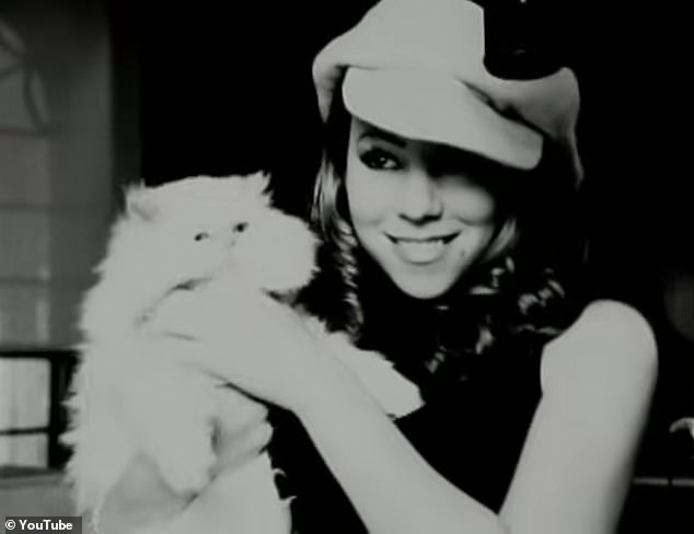 Mariah Carey holds her cat Clarence, who appeared in the 1996 music video for 'Always Be My Baby'