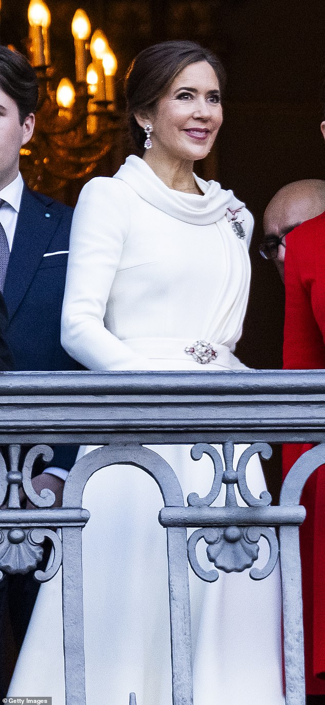 The queen combined her Soeren Le Schmidt dress with pieces from a precious jewelry set encrusted with red rubies.  The red and white combination is a nod to the Danish flag