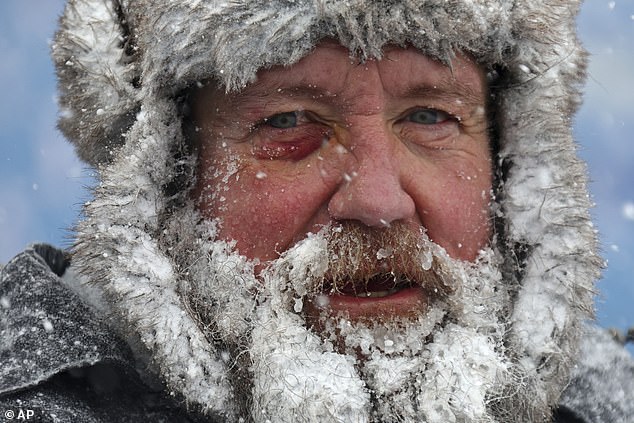 Fans, like this man, were invited to clean up the Bills' stadium in Orchard Park for $20 an hour