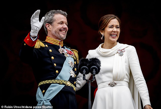 Queen Mary was a vision in white as she waved to fans on the balcony of Christiansborg Palace in Copenhagen with her husband King Frederick