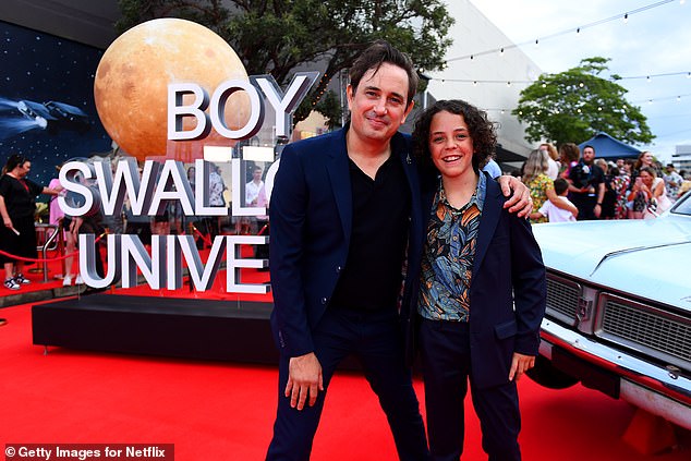 Trent Dalton (L) and Felix Cameron (R), who plays Eli Bell, pose for photos at the Netflix world premiere of Boy Swallows Universe on January 9, 2024 in Brisbane, Australia (Photo: Getty)