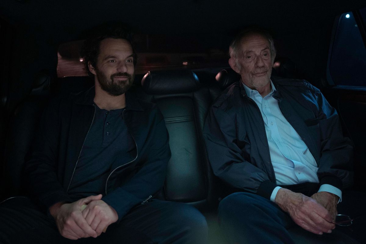 Tommy (Jake Johnson) sits in a darkened car next to his long-lost father (Christopher Lloyd) in Johnson's comedy Self Reliance