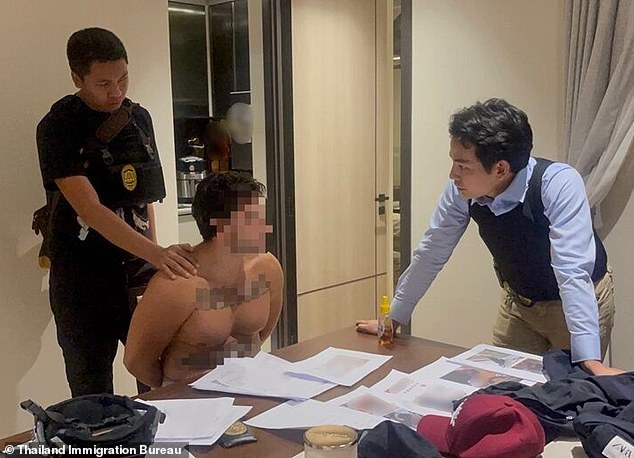 Rodrigo Elices was arrested by Thai immigration officials (pictured) who burst into a luxury apartment in Bangkok after allegedly posing as an Italian named Gjini to sneak into the country with a fake passport after landing on a private plane.