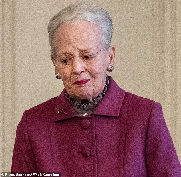 The mother of two, 83, wore a purple string which she paired with her ruby-and-diamond earrings and brooch