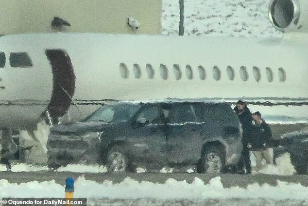 A black SUV was seen driving up to the plane, where her crew unloaded her belongings