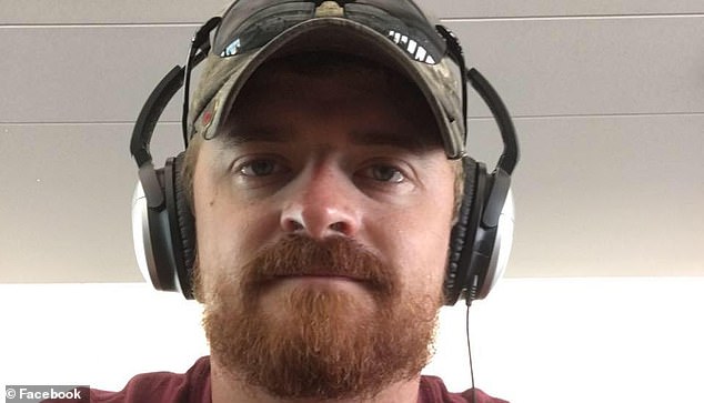 A photo of Dr.  Smith wearing headphones around his head while piloting an airplane on a previous flight