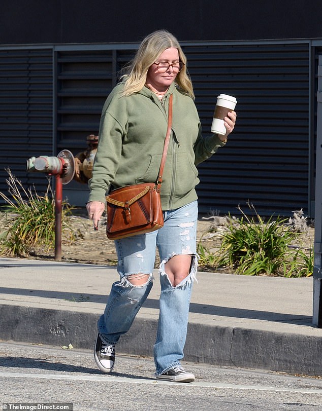 The Baywatch alum, 52, looked casual in an olive green hoodie and ripped jeans as she headed to a Jersey Mike's sub store