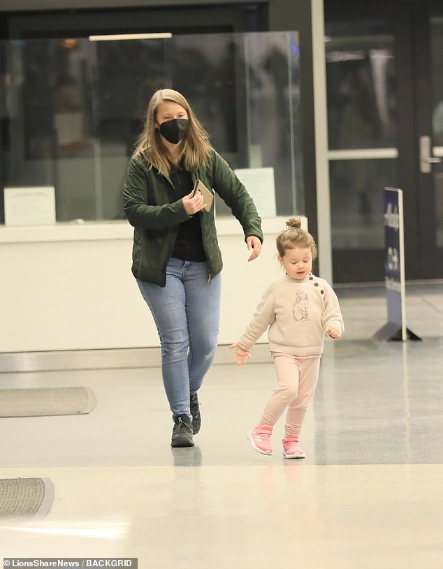 The cheeky tot looked very excited about the holiday as she ran through the arrivals hall, forcing Bindi to follow close behind her