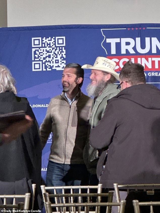 Don Jr.  told his supporters that critics are trying to suppress the vote by claiming his father is so far ahead in the polls, hoping his supporters won't show up on Monday.  Pictured: Donald Trump Jr.  speaks to supporters after remarks in Ankeny, Iowa, just hours before the Iowa caucuses opened