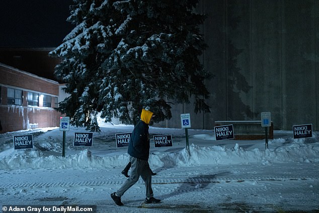 People arrive at Franklin Jr.  High, Precinct Des Moines 33, for the Iowa Caucus voting in Des Moines, Iowa