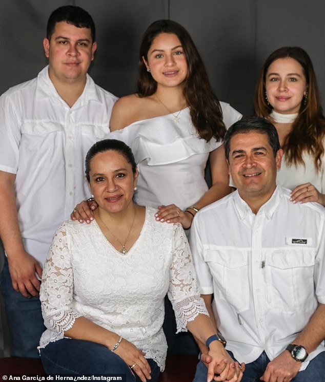 The indictment prepared by US judicial officials charges Hernandez (pictured with his wife and three children) with three counts of drug and weapons crimes