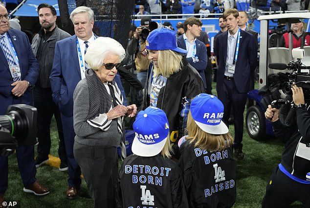 Kelly greets Martha Firestone Ford, Lions owner/chairman emeritus, left, pregame on Sunday