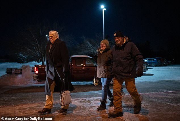 Three caucusgoers appear at the Franklin Jr.  High School in Iowa, ready to cast their votes