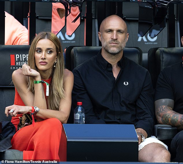 The WAG and her retired AFL player husband, both 40, looked uncomfortable next to the former Mongols chapter boss on Sunday