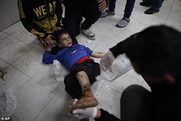 Palestinians injured in the Israeli bombardment of the Gaza Strip are being treated at a hospital in Khan Younis on Monday