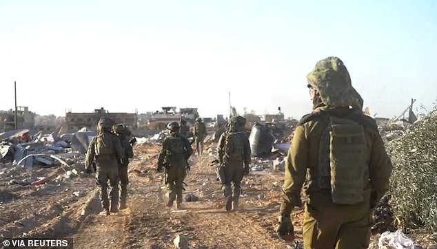 Israeli soldiers operate in the Gaza Strip on Tuesday amid the ongoing conflict between Israel and Hamas