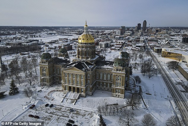 Snow and ice surround the Iowa State Capitol Building in Des Moines, Iowa