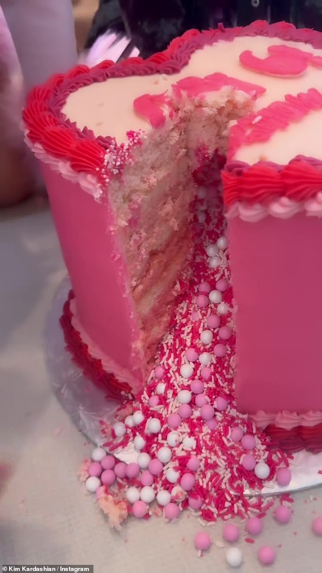 The cake was full of pink and white candies