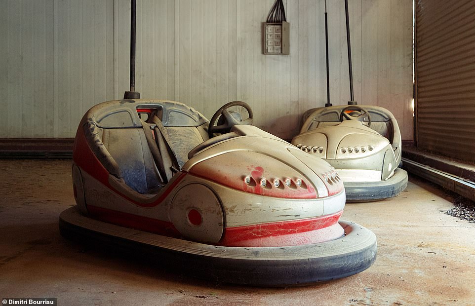 This photo shows a few bumper cars at Lucky Star Park that have been collecting dust