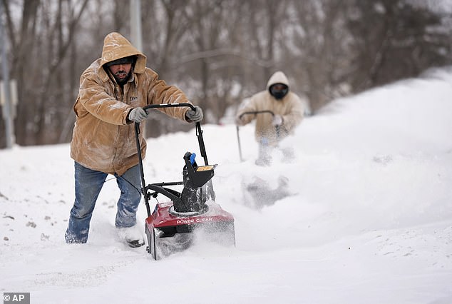 Iowans faced freezing temperatures and heavy snow in the final stages of the race